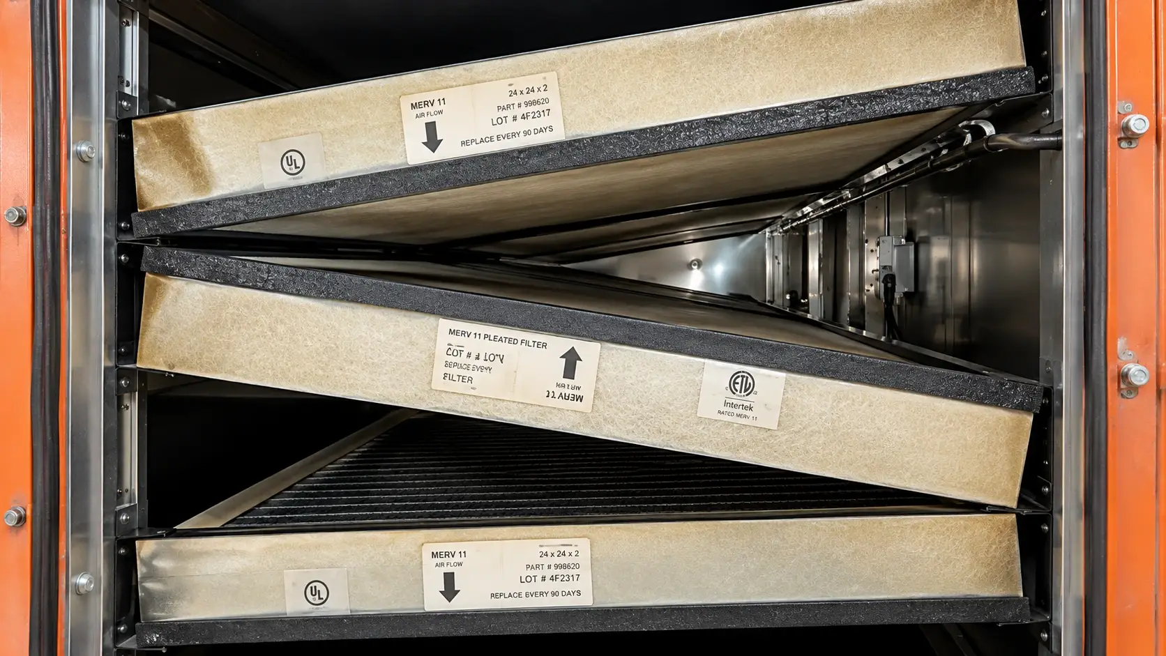 Grease-covered commercial kitchen exhaust filters prepared for professional hood cleaning and NFPA 96 kitchen exhaust maintenance