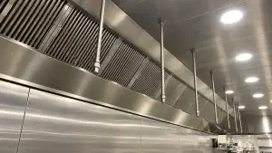 Commercial kitchen hood and exhaust system with clean stainless steel baffle filters for NFPA 96 kitchen exhaust maintenance