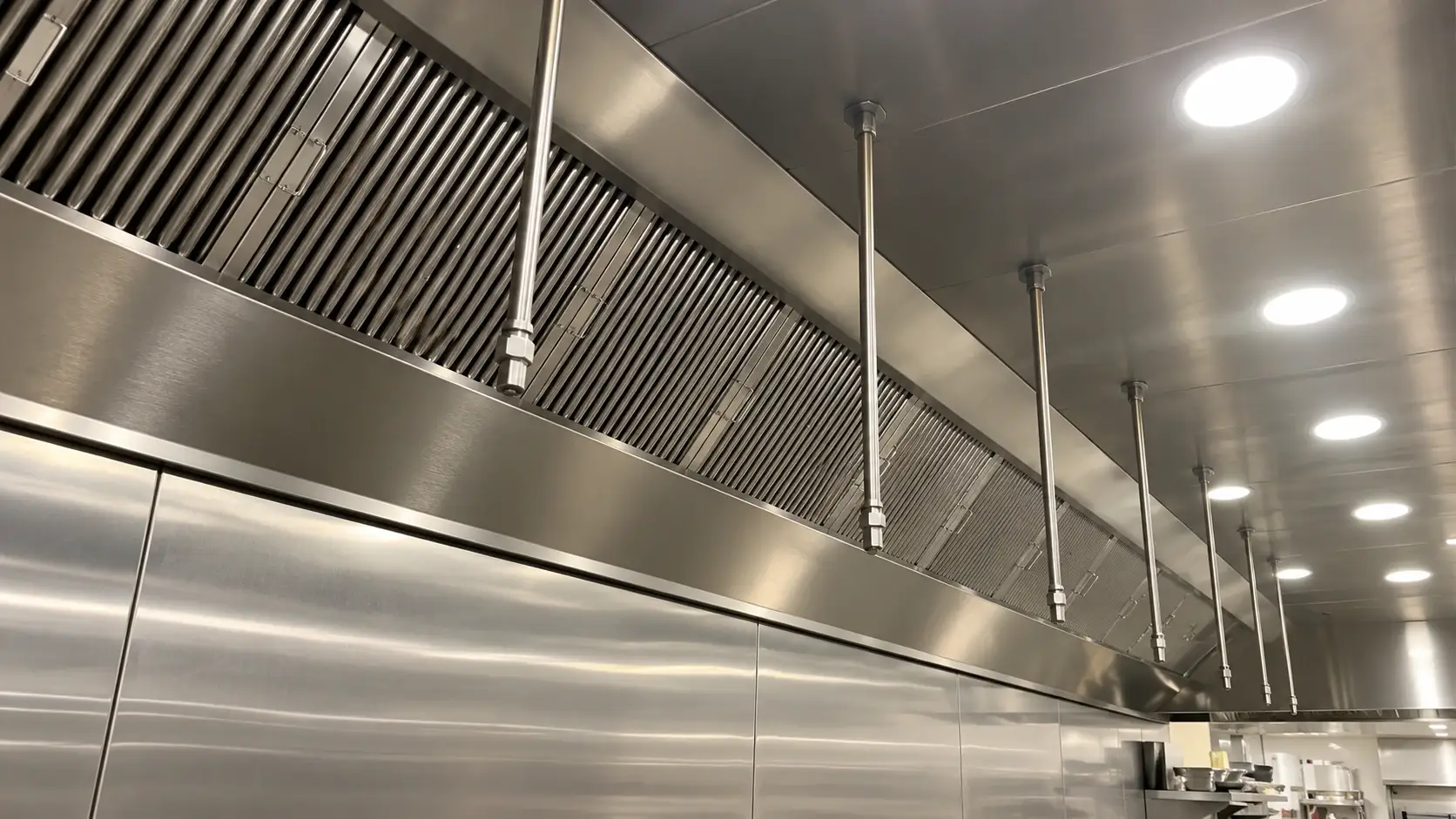 Commercial kitchen hood and exhaust system with clean stainless steel baffle filters for NFPA 96 kitchen exhaust maintenance